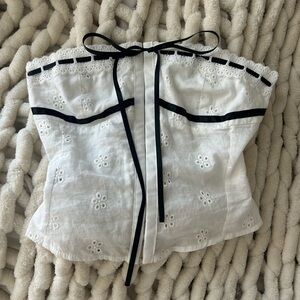 White Eyelet Strapless Corset Top with Black Trim and bow